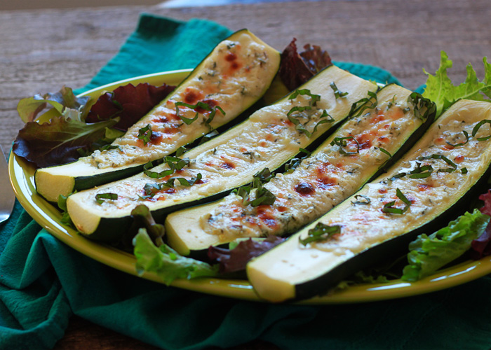 A plate of cheese-stuffed zucchini boats. 