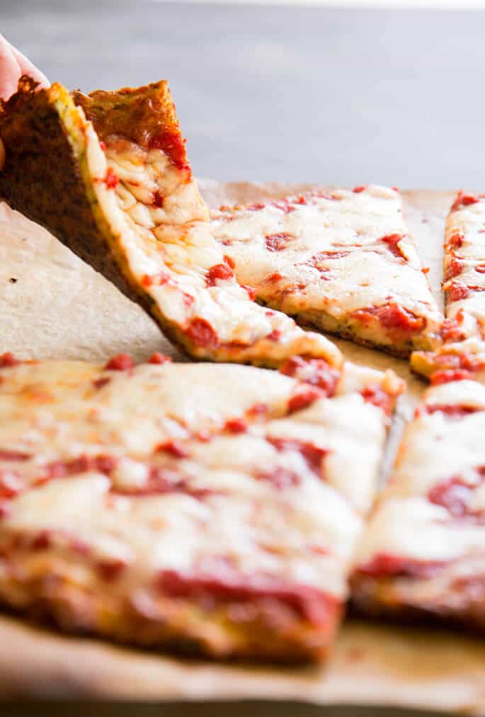 A foldable slice of gluten-free zucchini-based pizza crust