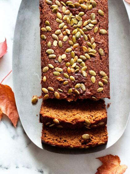 A loaf and slices of gluten-free pumpkin bread