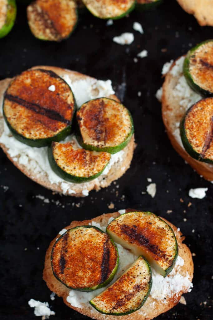 Crostini layered with cheese and grilled spiced zucchini